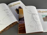 an open book with a drawing of a man in a cowboy hat