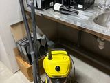 a vacuum that is sitting on the floor in a room