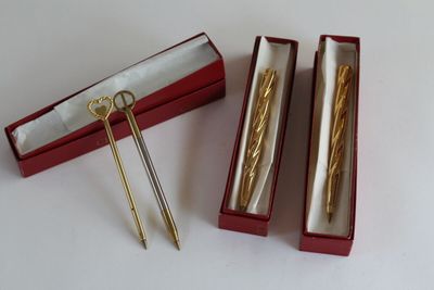 a pair of scissors in a box and a pair of scissors in a box