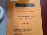 a sign that says cnc lathe center next to a toilet