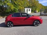 a picture of a red car parked on the side of the road