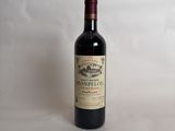 a bottle of wine that is sitting on a table