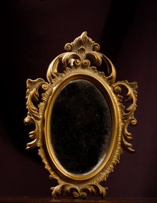 a mirror that is sitting on top of a table