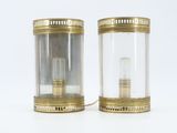 pair of antique brass and glass table lamps on a white background