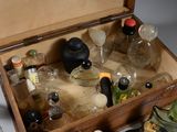 a wooden box filled with bottles and bottles of alcohol