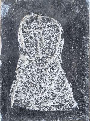 a black and white drawing of a woman ' s face on a piece of paper
