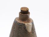 a small bell that is sitting on top of a table