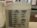 a white container sitting on top of a counter next to a sink
