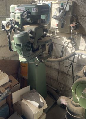 a machine that is sitting next to a pile of boxes