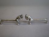pair of antique silver plated figurines of a man and a woman
