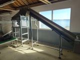 a picture of a conveyor belt in a warehouse
