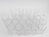 a lot of glasses that are sitting on a table