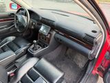 dashboard of a car with leather seats and steering controls in a parking lot