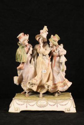 a figurine of a group of people on a black background