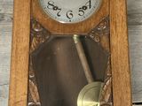 a clock that is hanging on the side of a wall