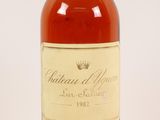 a bottle of wine sitting on top of a white surface