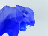 a blue elephant that is standing in the air