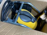 a box that has a yellow and black vacuum in it