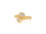a close up of a gold ring with diamonds on it
