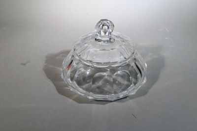 a clear glass jar with a lid on a table
