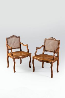 pair of antique chairs with cane back and cane arms