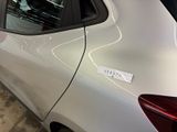 a white car with a sticker on the side of it