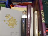a box full of books sitting on top of a table