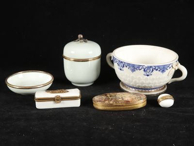 a bowl, bowl, cup, and other items on a table