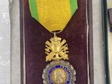 two medals and a book on a table