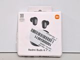 a box with a pair of ear buds in it
