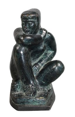 statue of a man sitting on a base with his hands on his knees