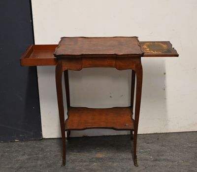 a small wooden table with a drawer on it