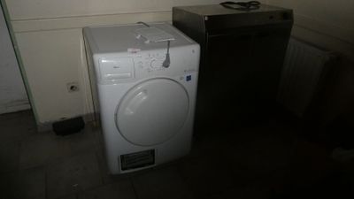 a washer and a dryer in a small room