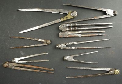 a lot of old tools that are on a table