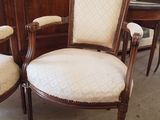 two chairs sitting next to each other in a room