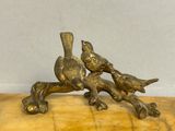 two birds that are sitting on a tree branch
