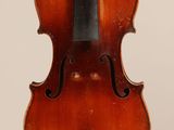 an old violin with a bow hanging from it ' s back