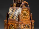 an old wooden box with a clock on top of it