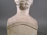 marble bust of a woman with her hair in a bunt
