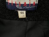 a close up of a label on a black jacket