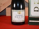 a bottle of wine sitting next to a box of wine