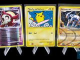 three different pokemon cards are displayed on a black background