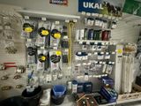 many items on the wall in the store for sale