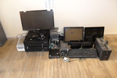 a lot of electronic equipment that is sitting on the floor