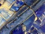a close up of a blue and white tiled floor
