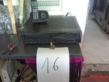 a picture of a table with a phone and a sign on it