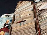 a box full of old books and magazines on a table