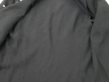a close up of a jacket with buttons on the back of it