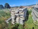 a pile of wood sitting in the middle of a field