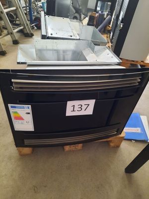 a black oven with a number on it in a store